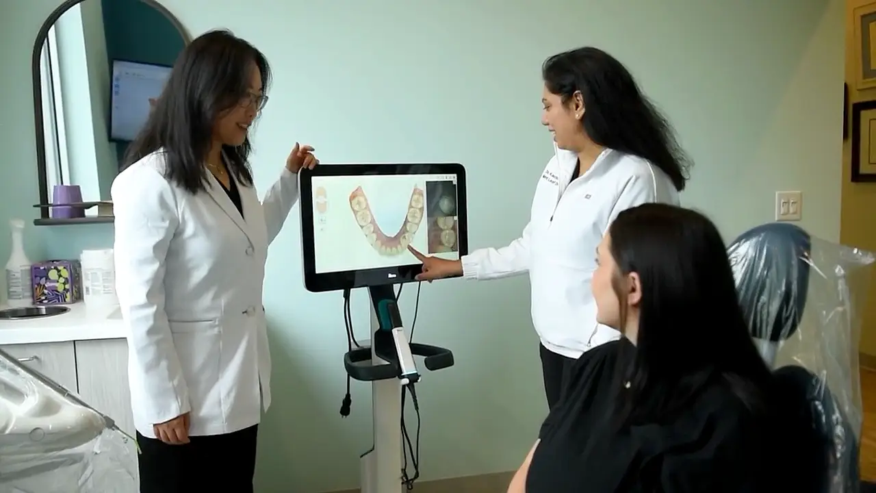 Reviewing a 3D digital scan with a patient at Mint Leaf Dentistry
