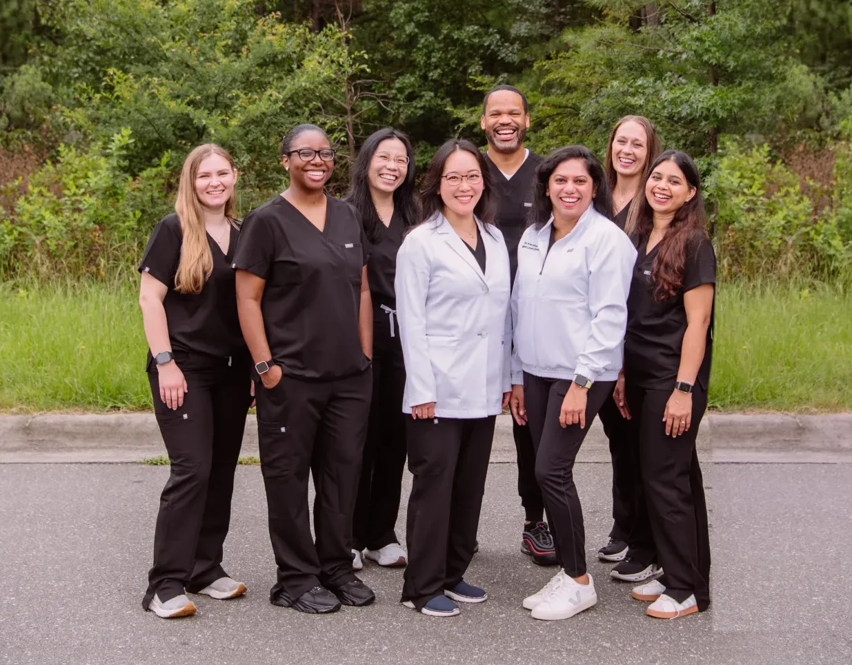 The Mint Leaf Dentistry team together outside the practice