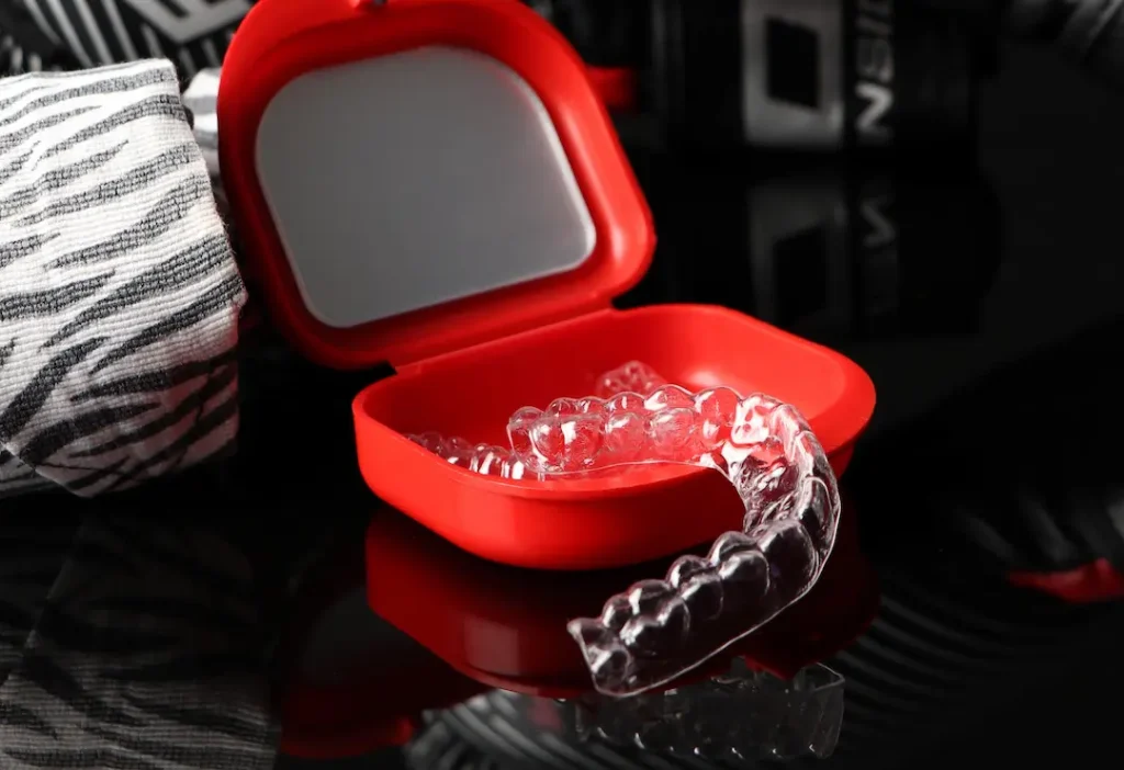 Picture of Invisalign clear aligners in an aligner case for the blog How Long Does Invisalign Take?